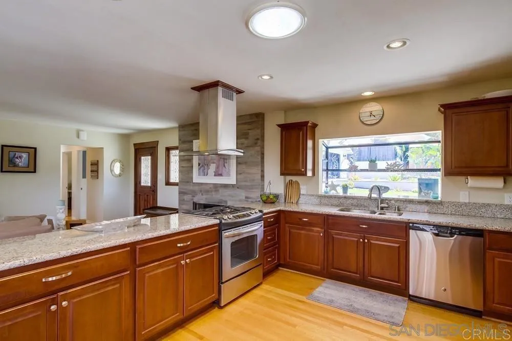 1582 Sunrise Drive Vista, CA 92084 - Photo 7 of 17 a kitchen with lots of counter space and a sink