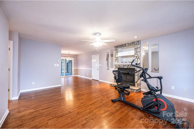 a view of a room with gym equipment and a window