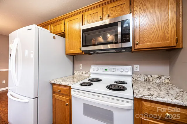 a kitchen with a stove and a microwave