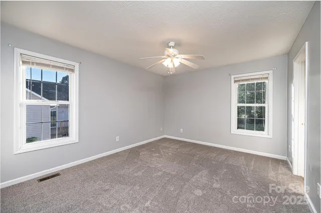 a view of empty room with windows