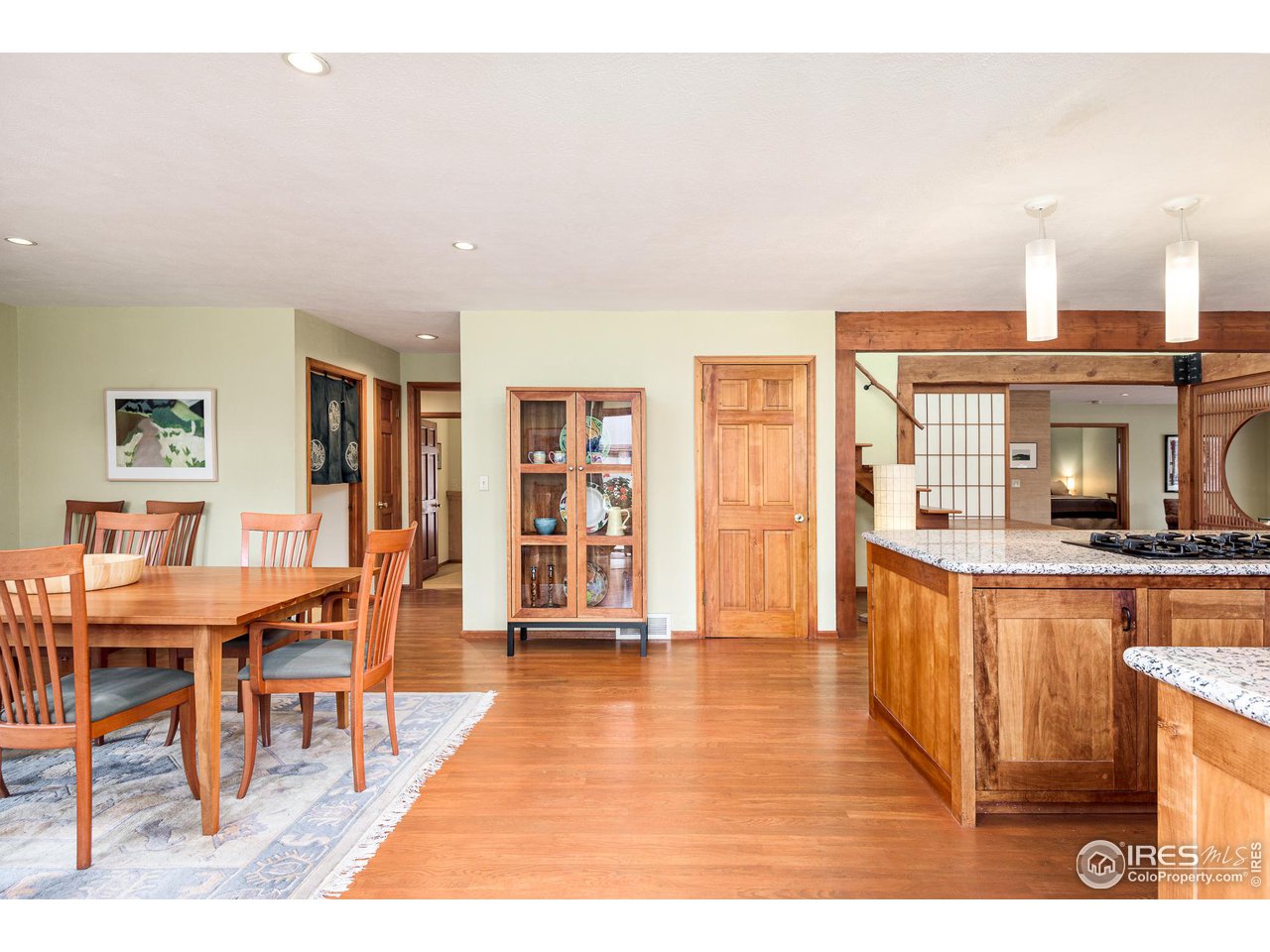 7845 Baseline Road Boulder, CO 80303 - Photo 23 of 40 a view of a living room and kitchen with furniture