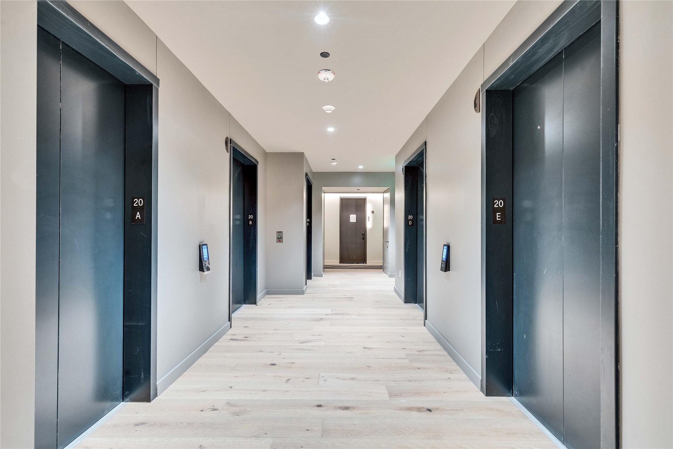 610 Davis Street, Unit 2003 Austin, TX 78701 - Photo 12 of 18 a view of a hallway with wooden floor and staircase