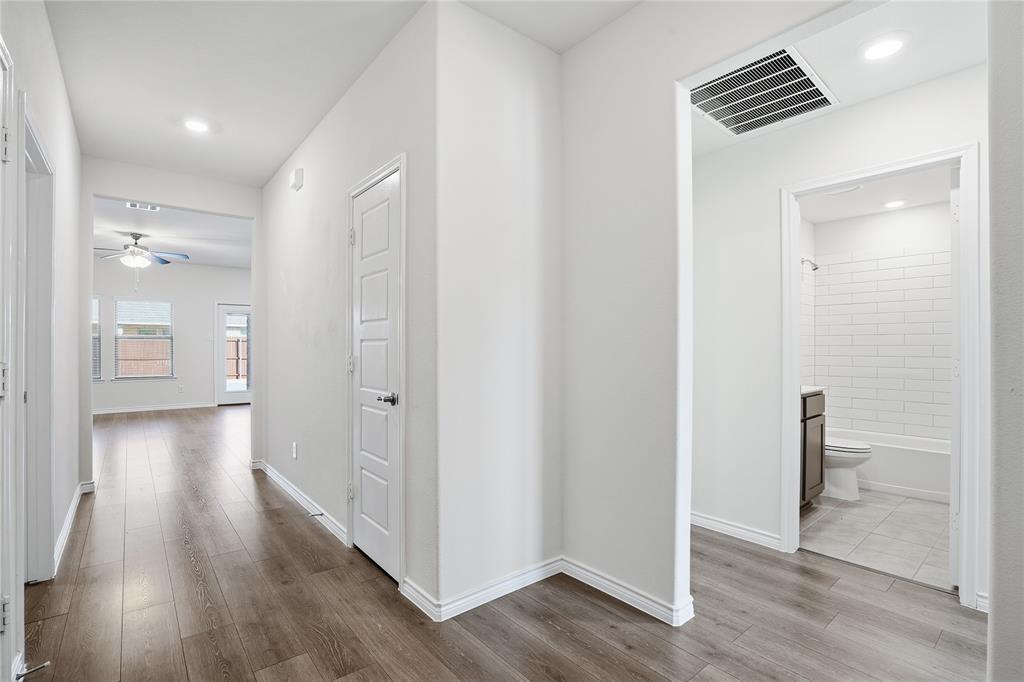 812 Indigo Road Princeton, TX 75407 - Photo 12 of 28 a view of hallway with wooden floor