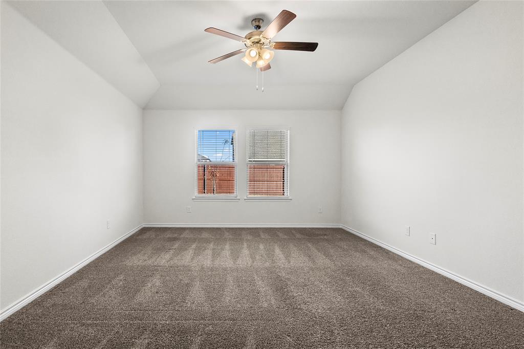 812 Indigo Road Princeton, TX 75407 - Photo 15 of 28 an empty room with fan and windows
