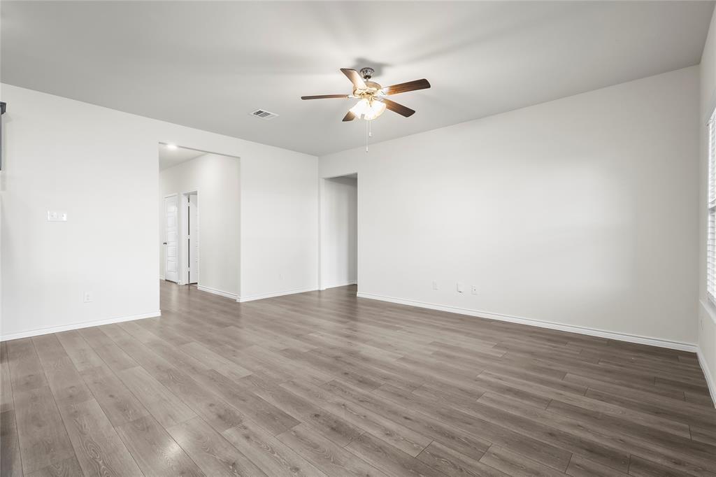 812 Indigo Road Princeton, TX 75407 - Photo 20 of 28 a view of an empty room with wooden floor