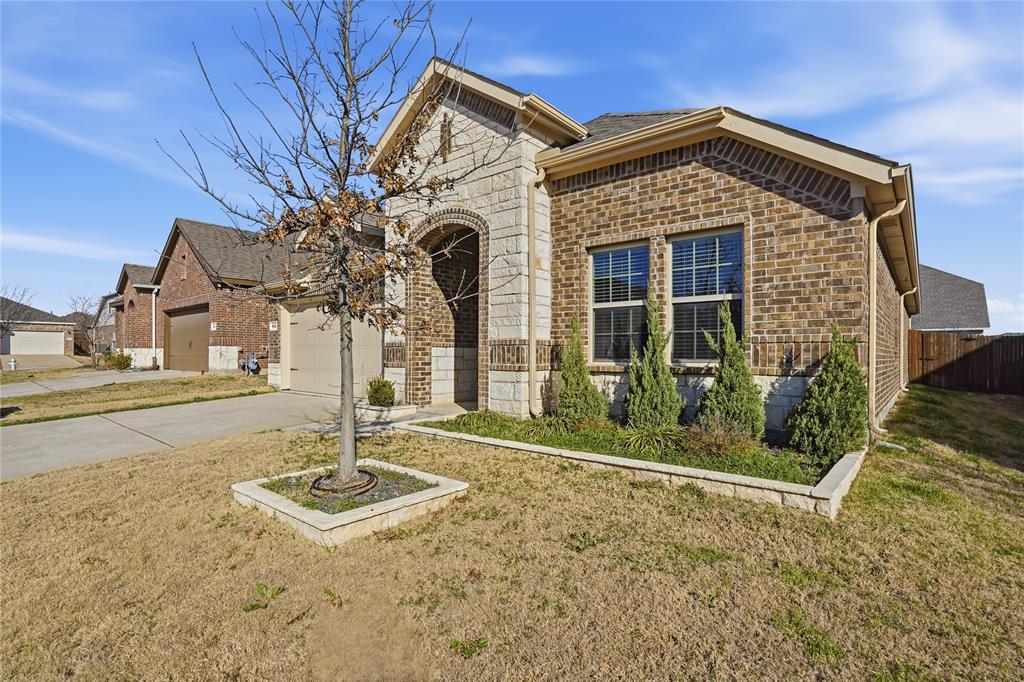 812 Indigo Road Princeton, TX 75407 - Photo 27 of 28 a front view of a house with a yard