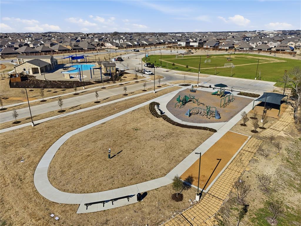 812 Indigo Road Princeton, TX 75407 - Photo 6 of 28 a view of a swimming pool with a terrace