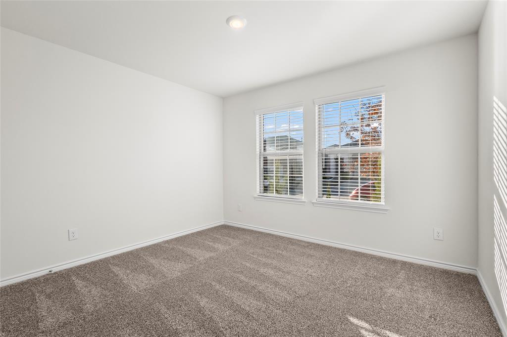 812 Indigo Road Princeton, TX 75407 - Photo 8 of 28 a view of an empty room with a window