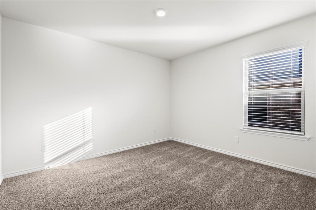 812 Indigo Road Princeton, TX 75407 - Photo 10 of 28 a view of an empty room with a window
