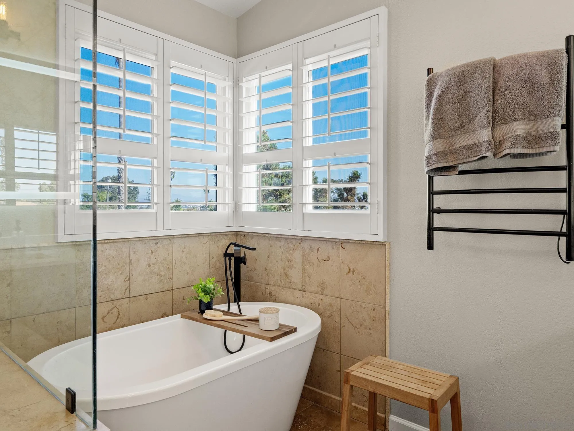 4385 Orchard Avenue San Diego, CA 92107 - Photo 24 of 55 a bath tub sitting next to a blue sink and a window
