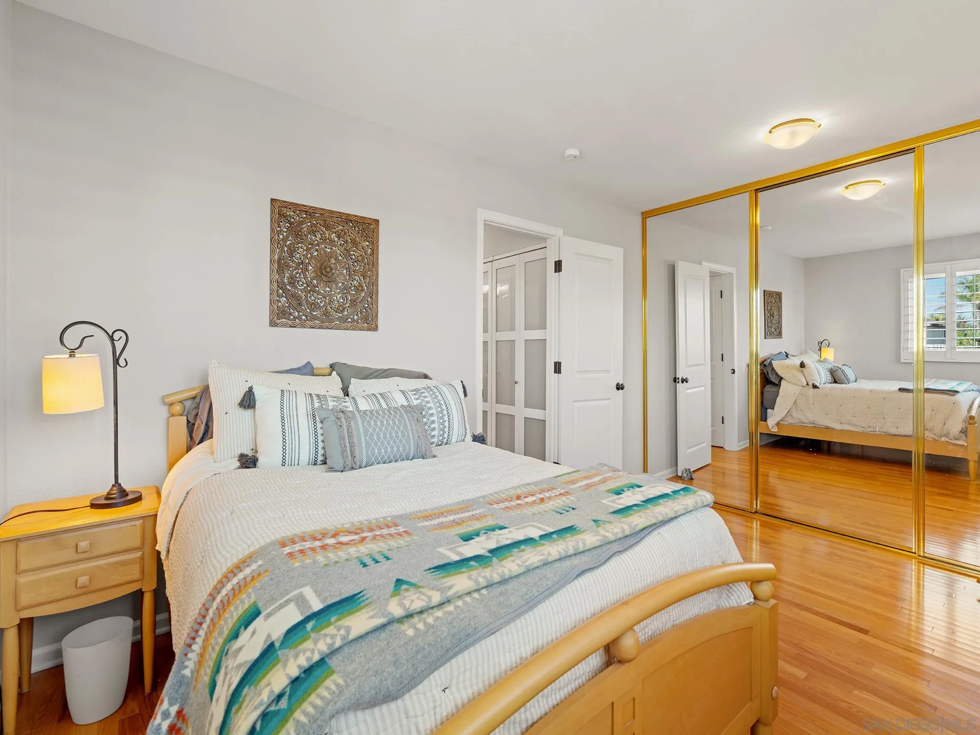 4385 Orchard Avenue San Diego, CA 92107 - Photo 28 of 55 a bedroom with a bed and a view of living room