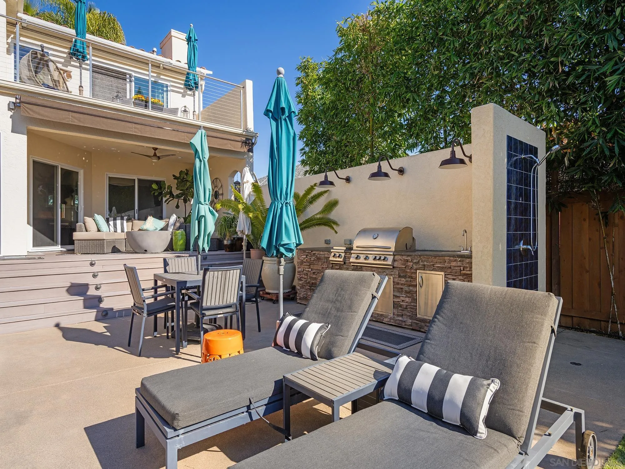 4385 Orchard Avenue San Diego, CA 92107 - Photo 35 of 55 a view of a patio with couches table and chairs and potted plants