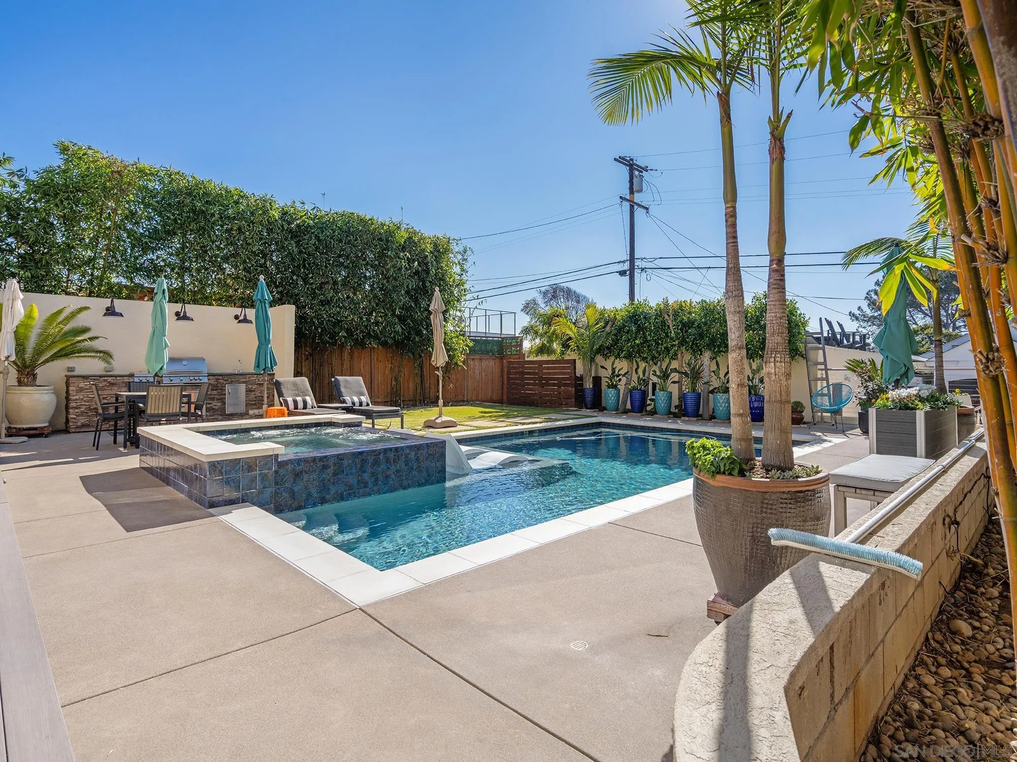 4385 Orchard Avenue San Diego, CA 92107 - Photo 37 of 55 a view of a swimming pool with a patio