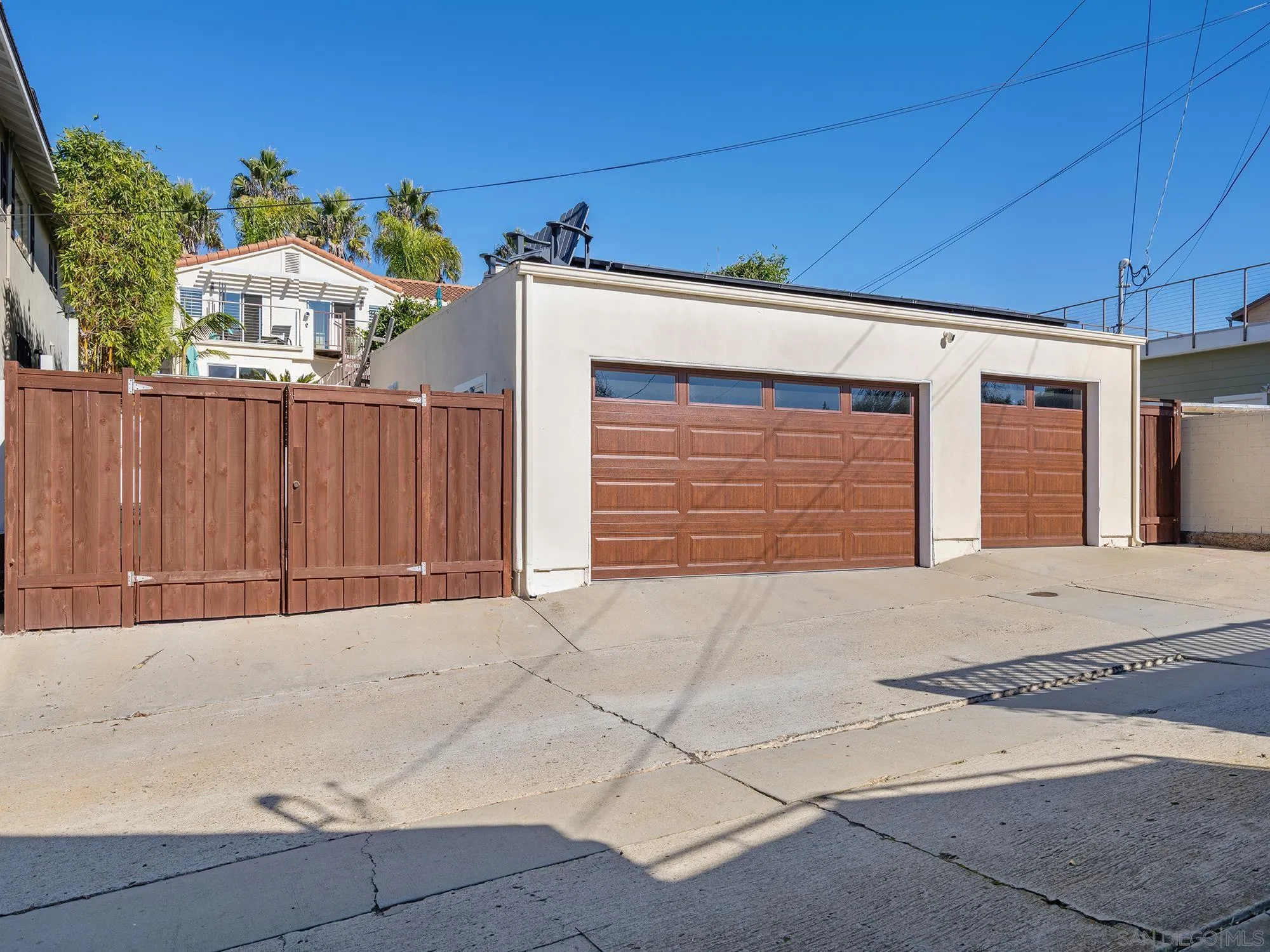 4385 Orchard Avenue San Diego, CA 92107 - Photo 38 of 55 a front view of a house with a yard and garage