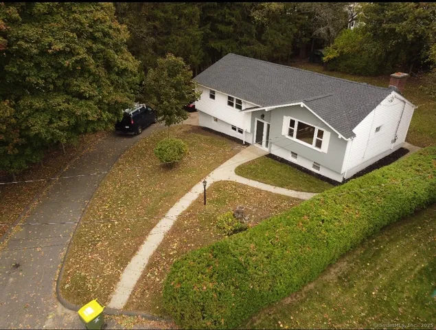 a aerial view of a house with a yard