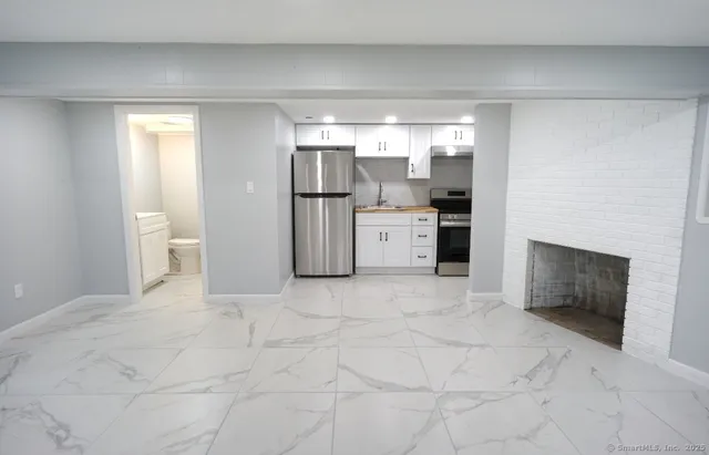 a view of a storage & utility room with a sink