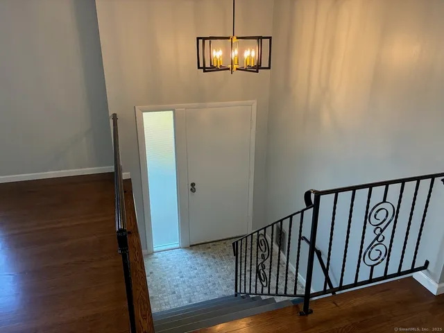 a view of entryway with wooden floor