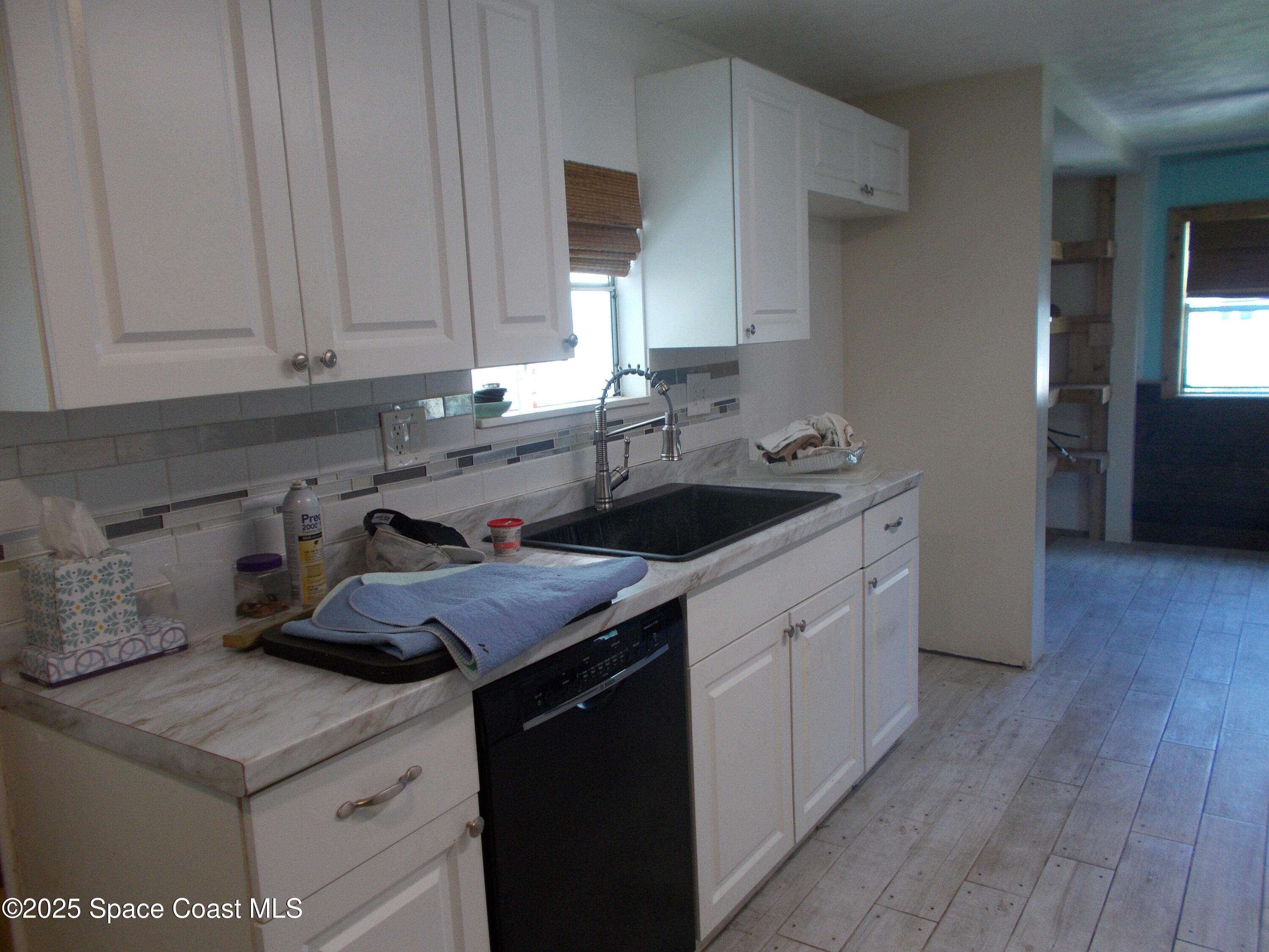 906 Spruce Street Sebastian, FL 32976 - Photo 12 of 26 a kitchen with a sink and cabinets