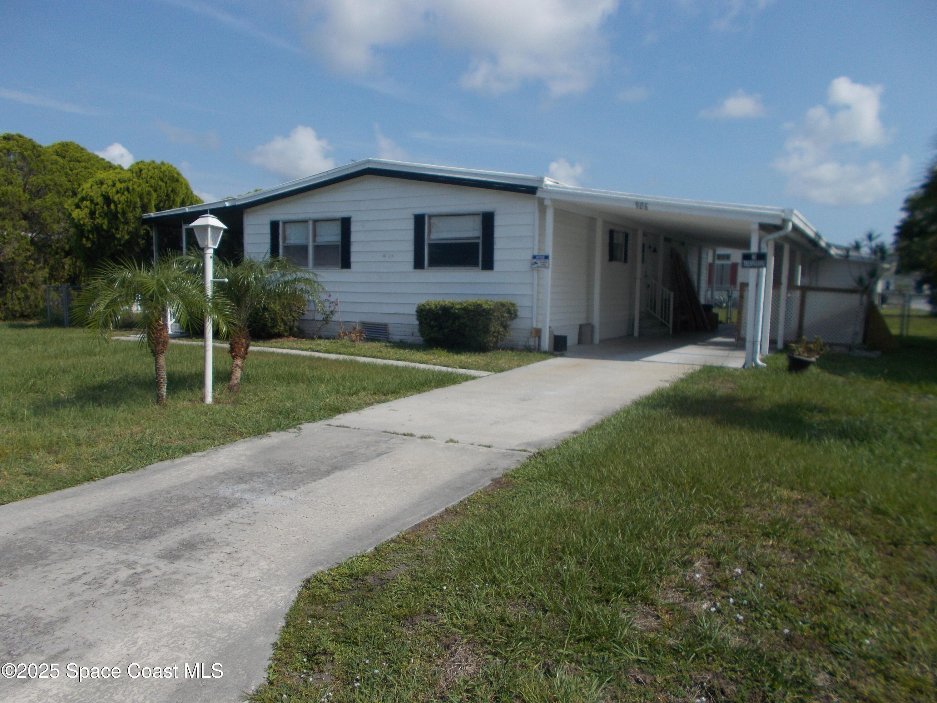 906 Spruce Street Sebastian, FL 32976 - Photo 22 of 26 a front view of a house with a yard