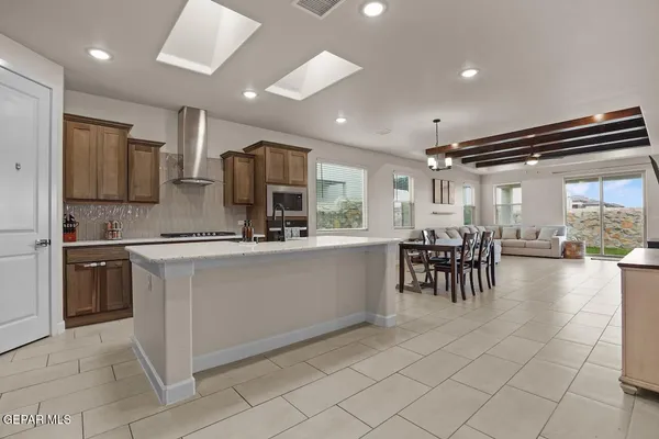 a kitchen with counter top space and appliances