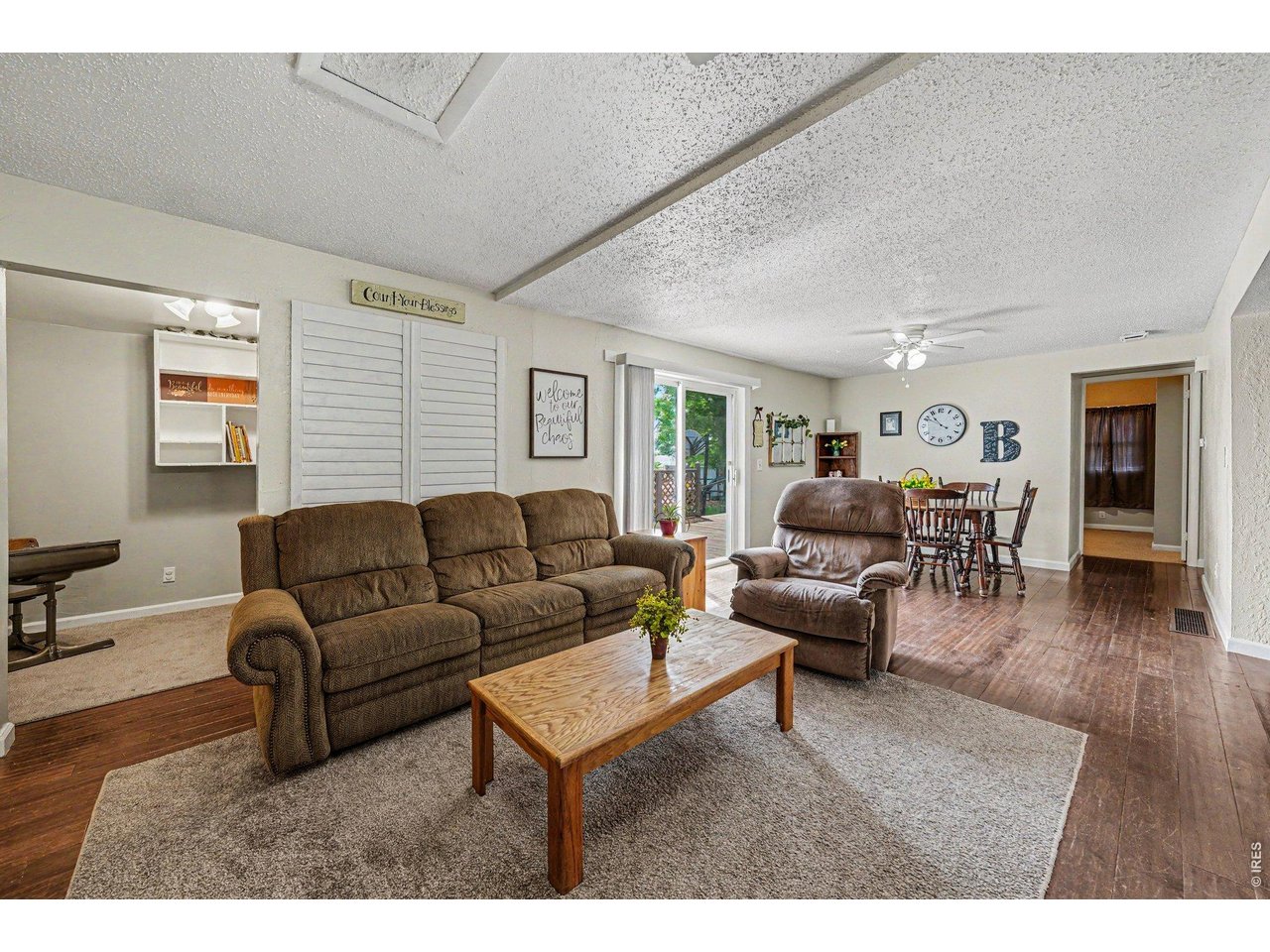 1430 30th Street Road Greeley, CO 80631 - Photo 4 of 22 a living room with furniture and wooden floor