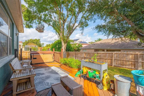 a view of balcony with wooden floor and outdoor seating