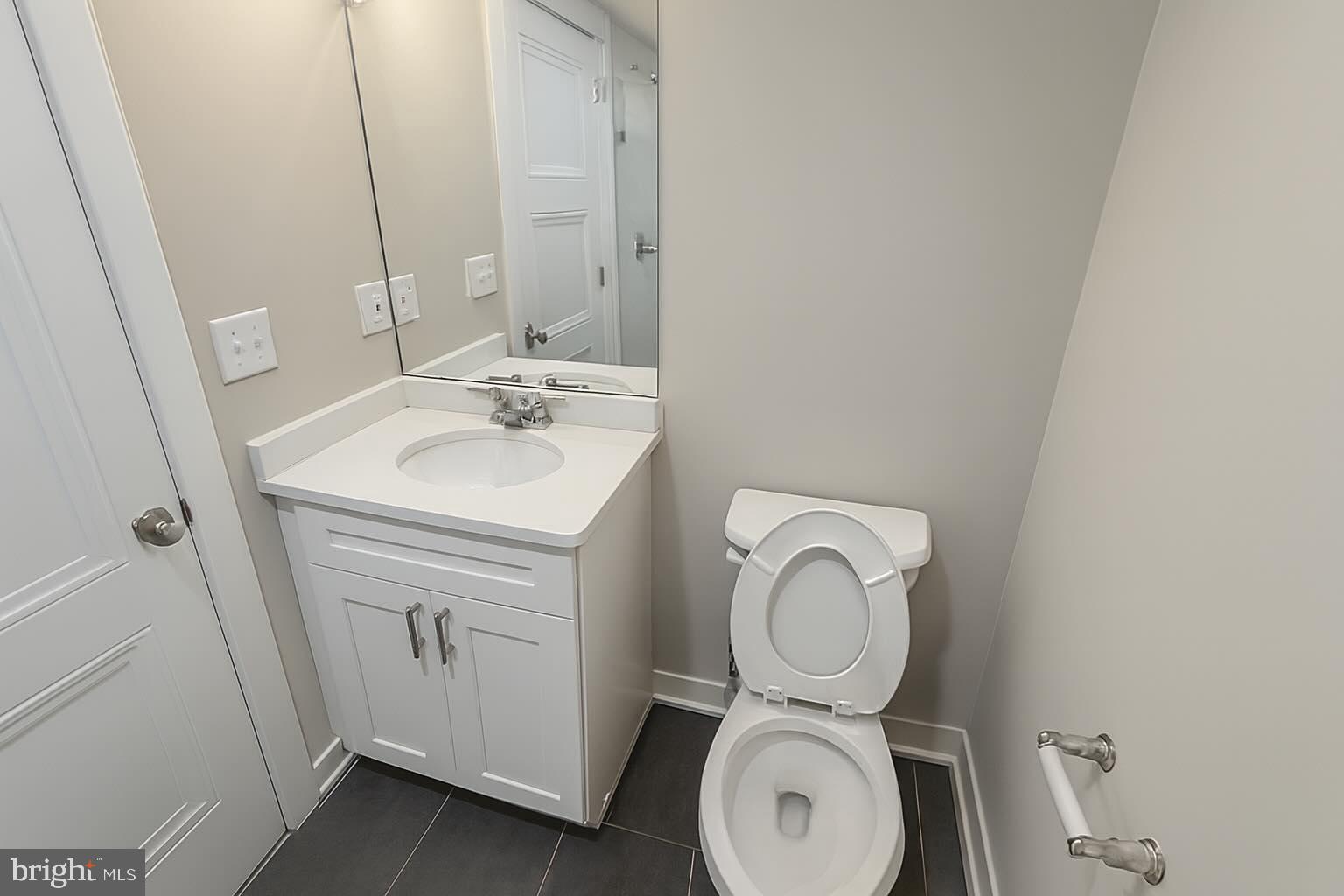 1407 North 8th Street, Unit A2 Philadelphia, PA 19122 - Photo 9 of 14 a bathroom with a sink and a mirror