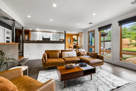 a kitchen that has a sink and a stove