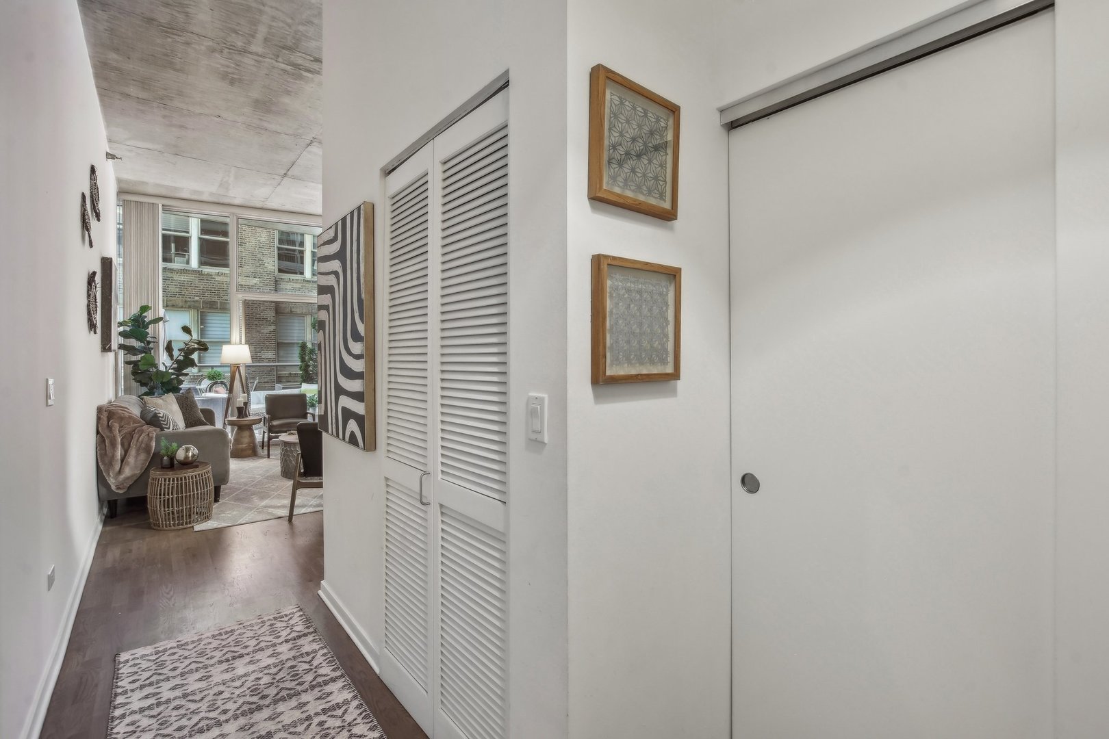 611 South Wells Street, Unit 702 Chicago, IL 60607 - Photo 20 of 32 a view of a hallway with workspace and a window