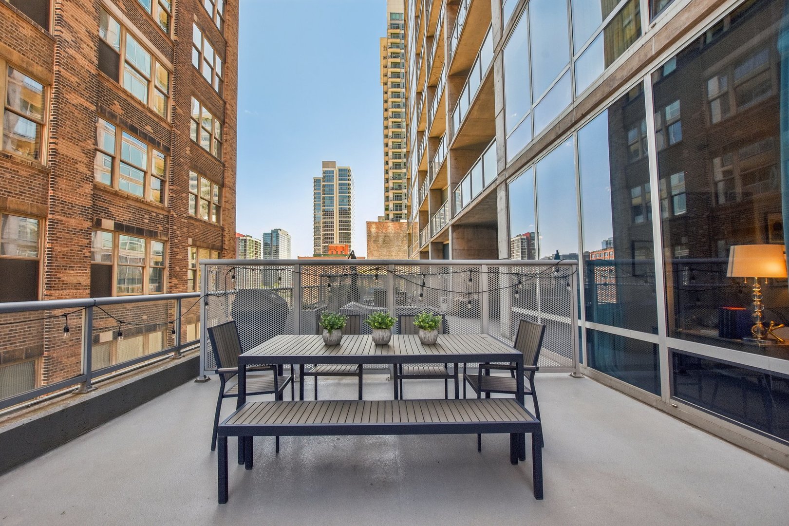 611 South Wells Street, Unit 702 Chicago, IL 60607 - Photo 4 of 32 a view of a building with outdoor seating