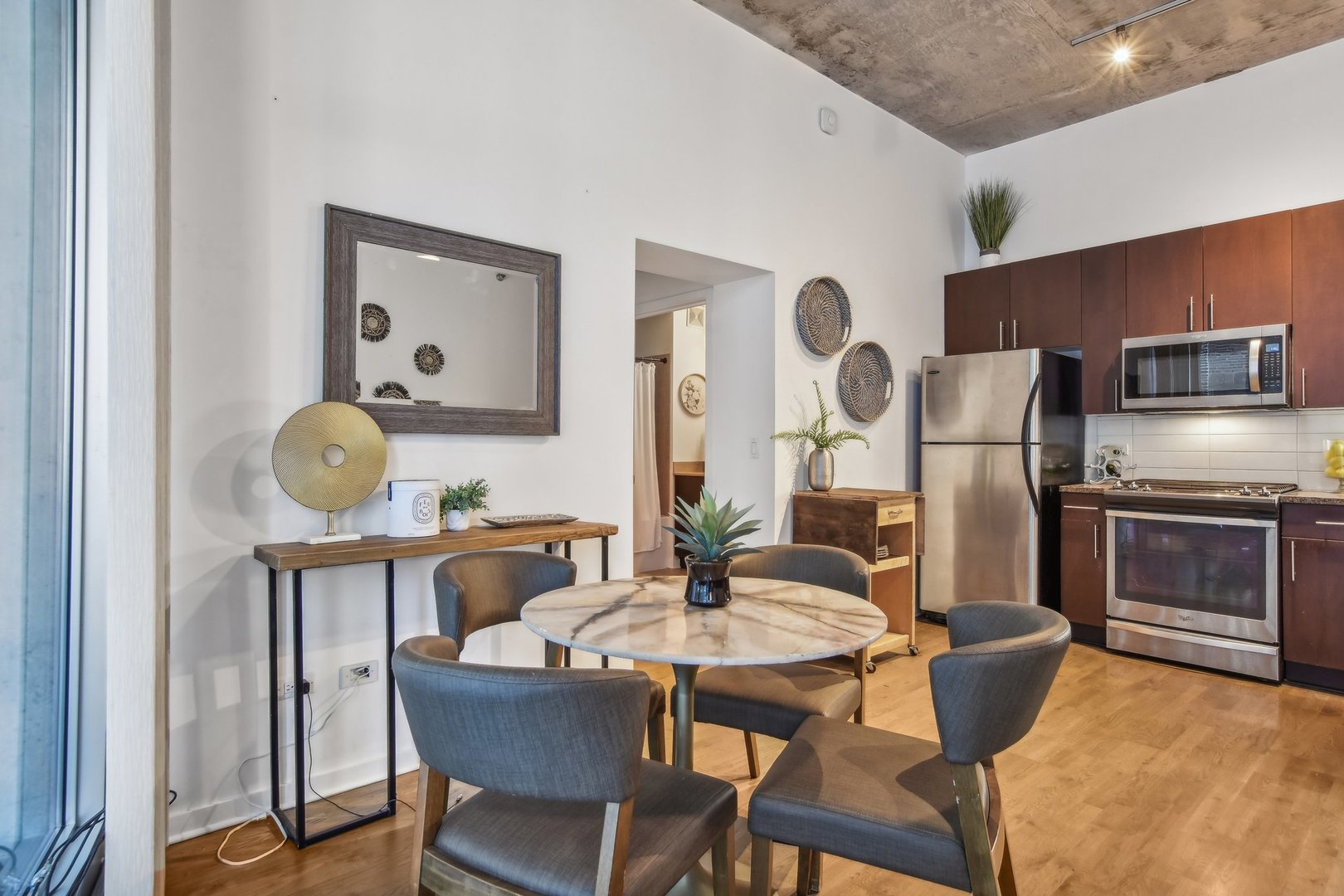 611 South Wells Street, Unit 702 Chicago, IL 60607 - Photo 7 of 32 a dining room with furniture and window