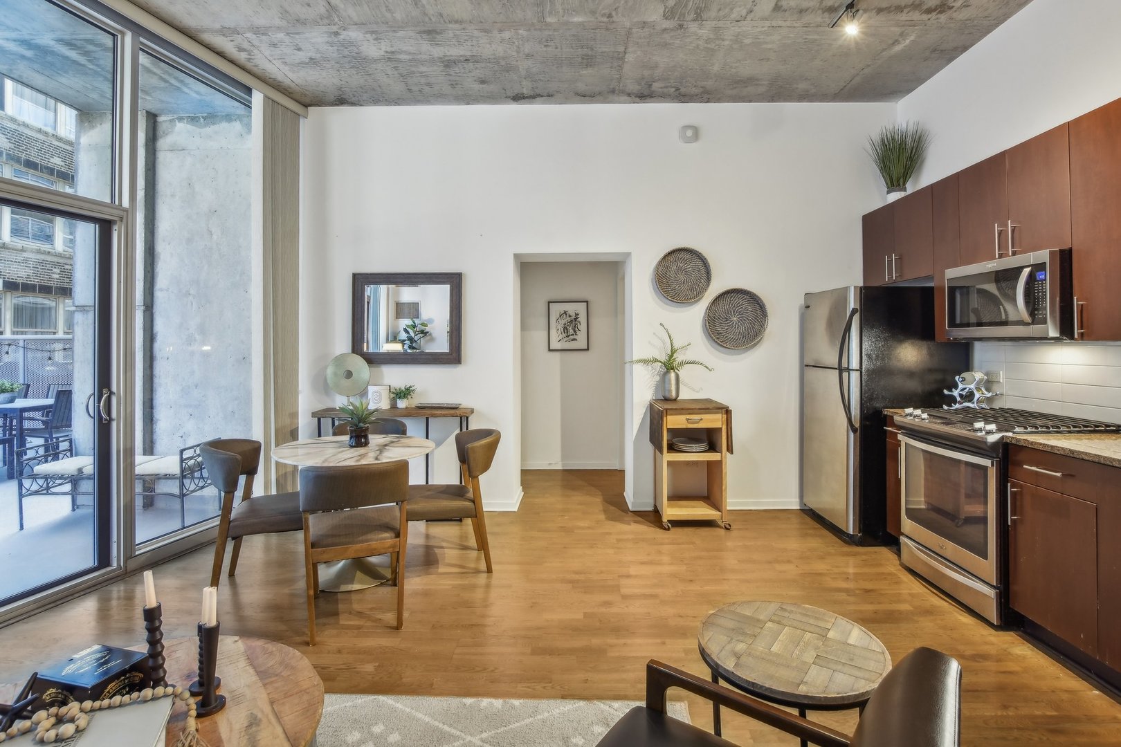 611 South Wells Street, Unit 702 Chicago, IL 60607 - Photo 10 of 32 a living room with fireplace furniture and a window