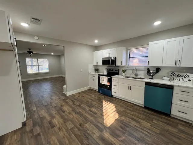 a house with trees in front of it