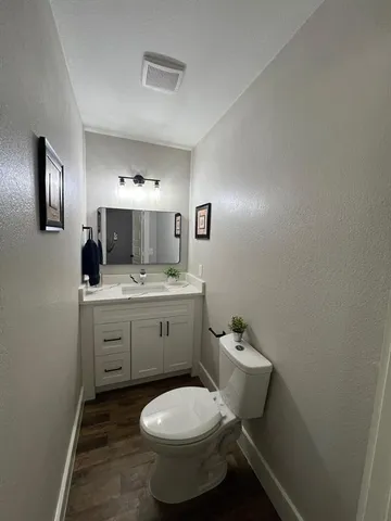 a bathroom with a bathtub a sink and mirror