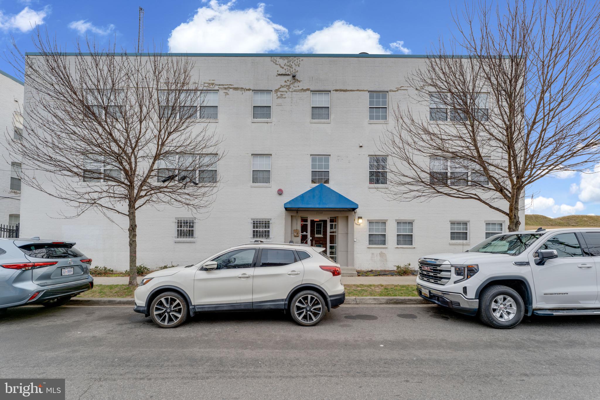 1008 Rittenhouse Street Northwest, Unit 15 Washington, DC 20011 - Photo 1 of 28 a car parked in front of a building