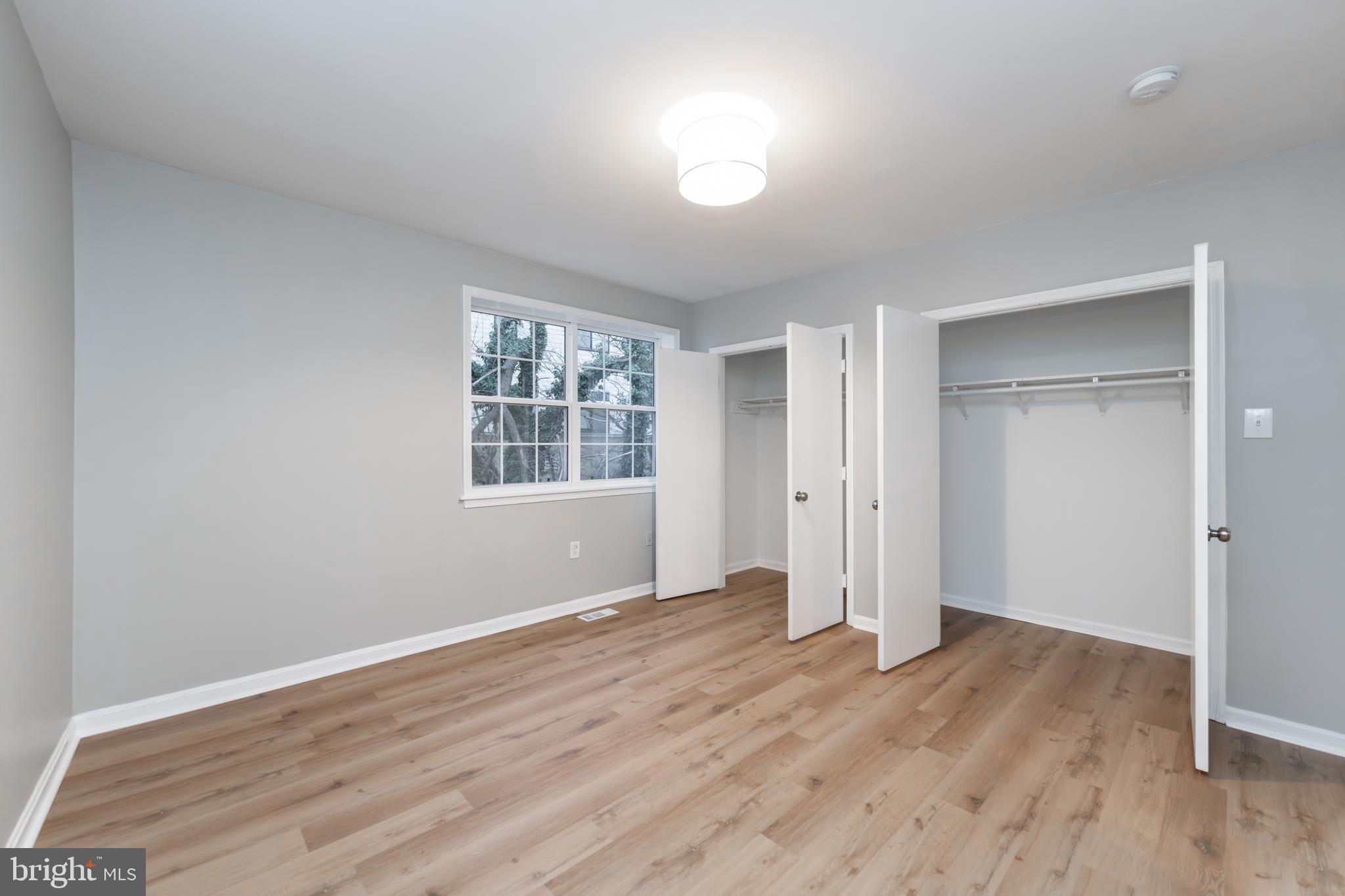 1008 Rittenhouse Street Northwest, Unit 15 Washington, DC 20011 - Photo 17 of 28 wooden floor in an empty room with a window