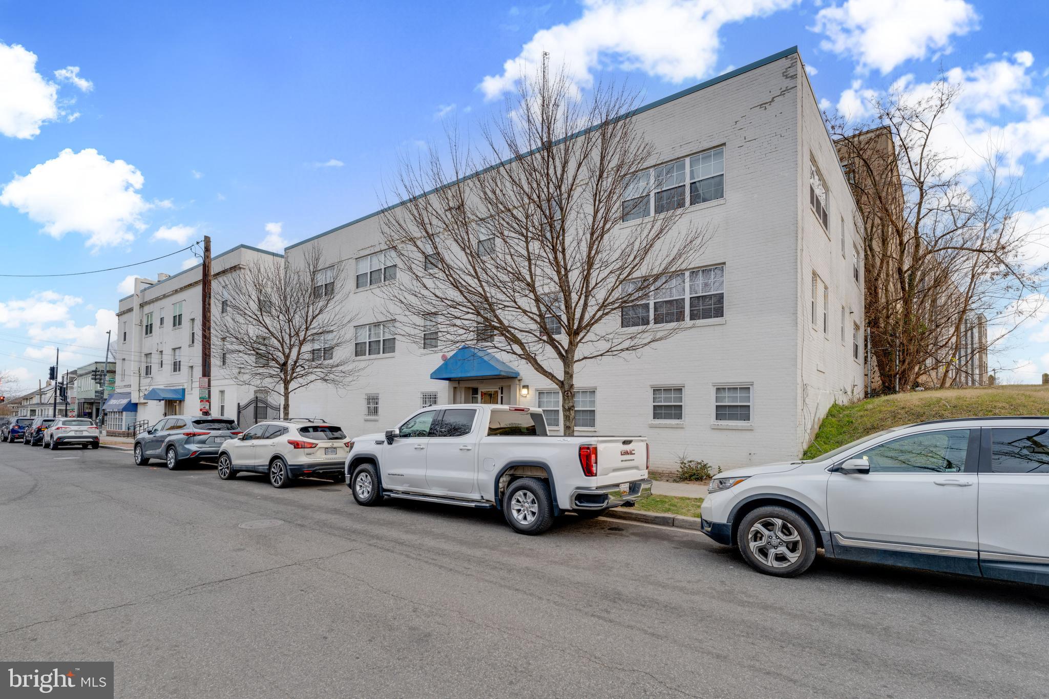 1008 Rittenhouse Street Northwest, Unit 15 Washington, DC 20011 - Photo 3 of 28 a view of cars parked in front of a building