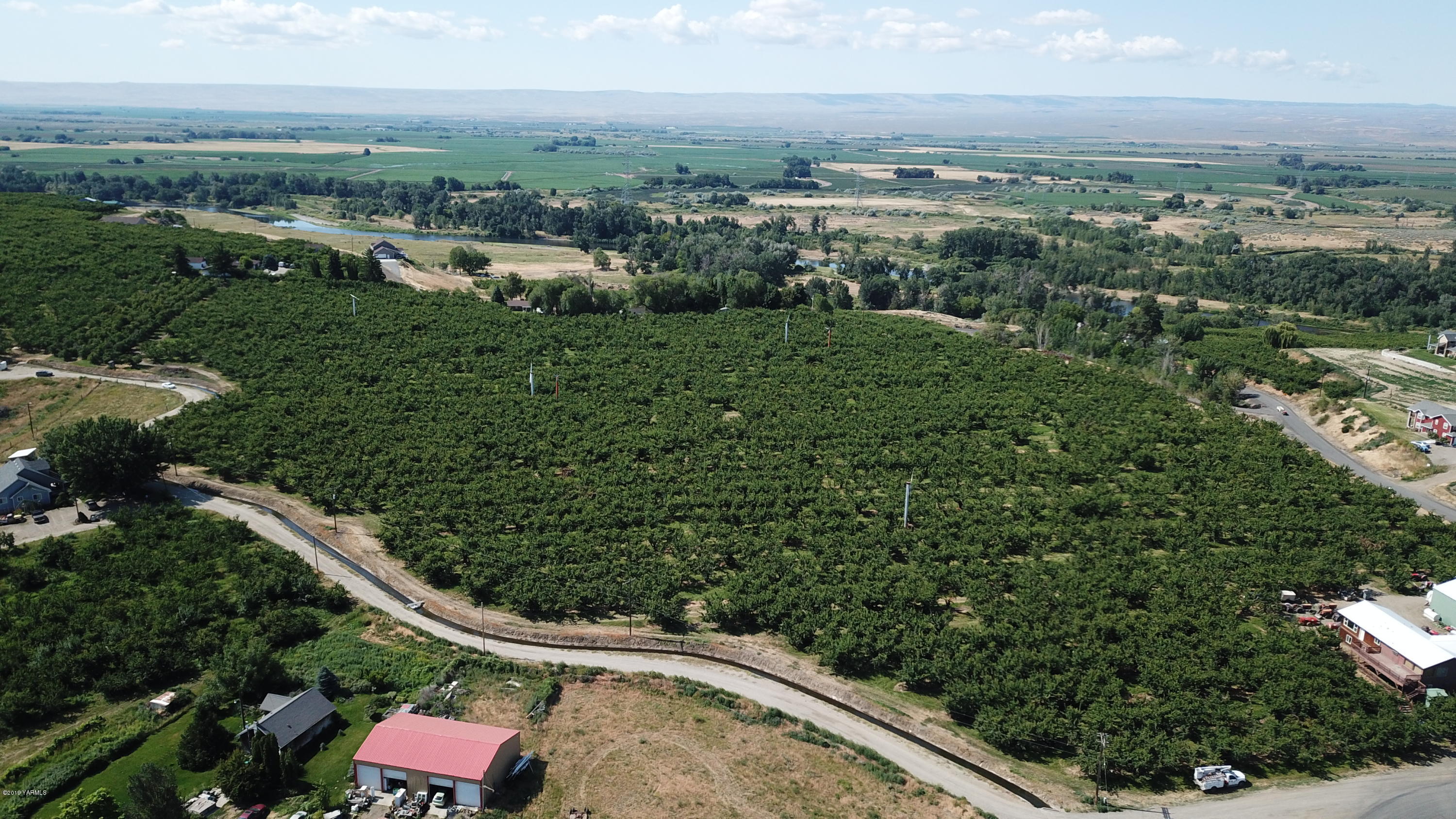 1711 Cherry Hill Road Granger, WA 98932 - Photo 2 of 5 an aerial view of a residential houses with outdoor space and trees