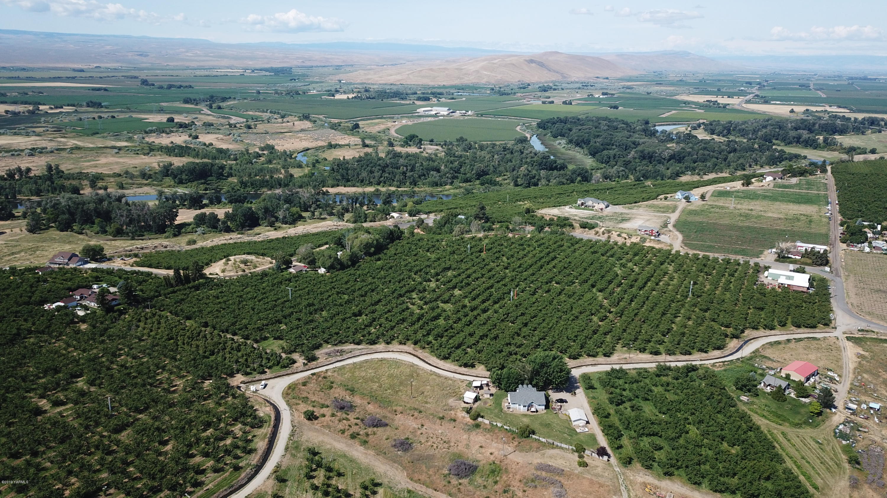 1711 Cherry Hill Road Granger, WA 98932 - Photo 5 of 5 an aerial view of residential houses with outdoor space and river