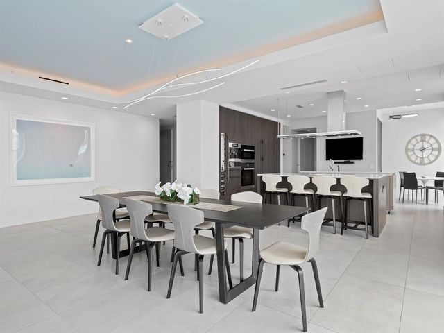 a view of a lake with a table and a chair