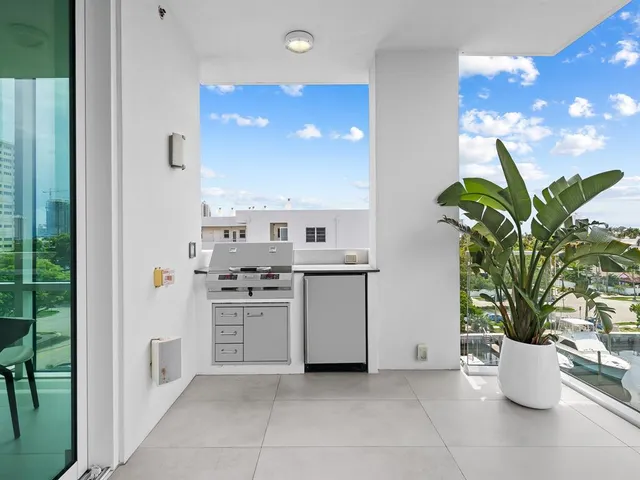 a bathroom with a toilet a sink and view