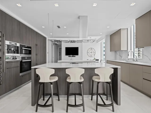 a bedroom with furniture and a flat screen tv