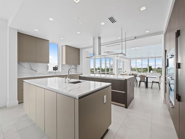 a livingroom with workspace and a couch