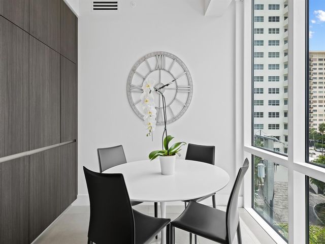 a bathroom with a shower a sink and mirror