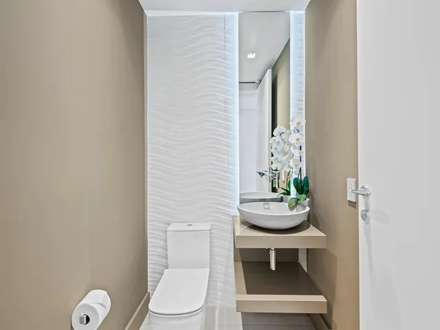 a bathroom with a sink a mirror and shower