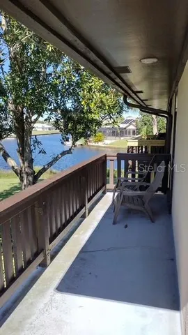 a view of living room kitchen with seating and green space