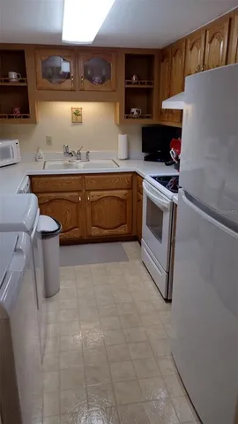a kitchen with a stove and a refrigerator
