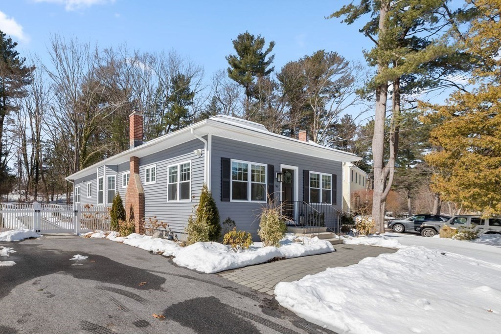 36 Eaton Road Framingham, MA 01701 - Photo 1 of 33 a front view of a house with a yard and trees