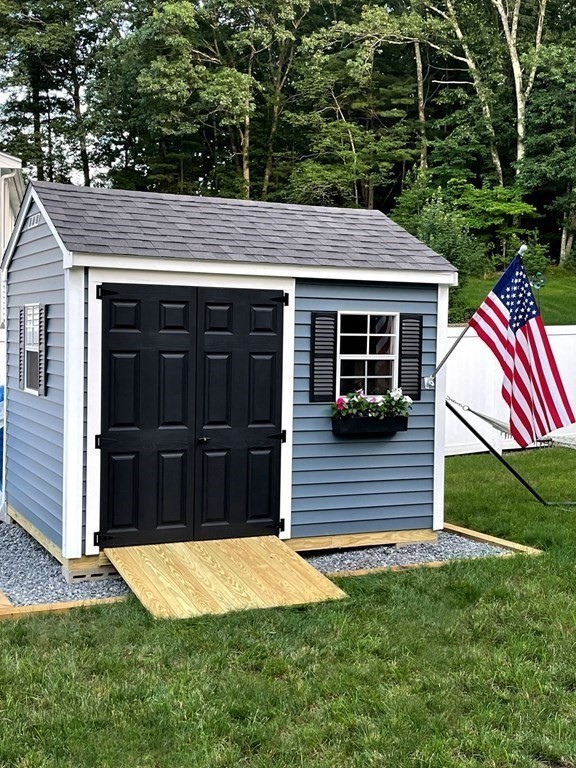 36 Eaton Road Framingham, MA 01701 - Photo 30 of 33 a view of a house with a backyard