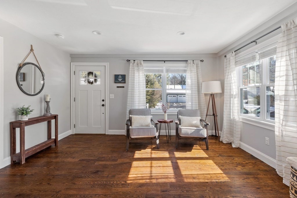 36 Eaton Road Framingham, MA 01701 - Photo 3 of 33 a living room with furniture a wooden floor and a large window